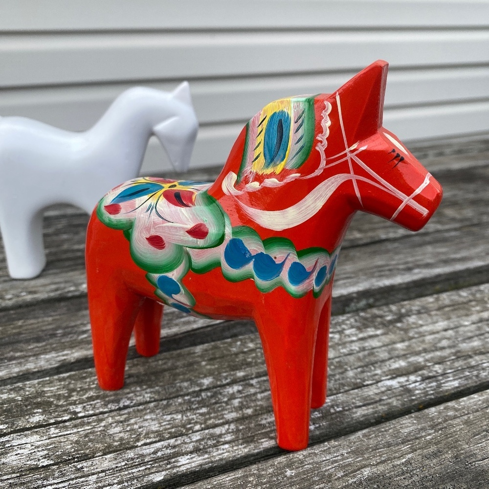authentic red traditional Swedish wooden Dala horse & white unmarked ceramic hor